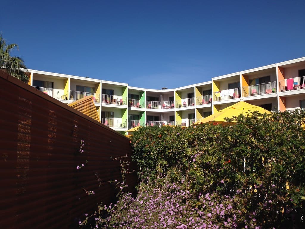 The Saguaro pool courtyard ringed by colorful balconies